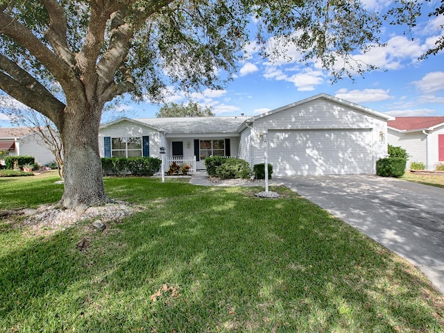 ranch-style home with a garage and a front lawn