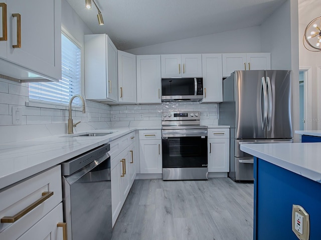 kitchen with white cabinetry, sink, and stainless steel appliances