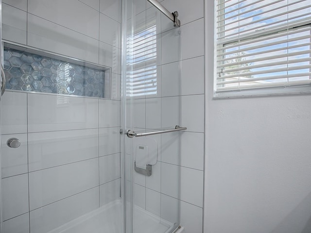 bathroom with an enclosed shower