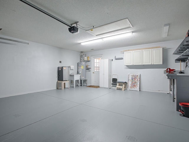 garage featuring water heater and a garage door opener