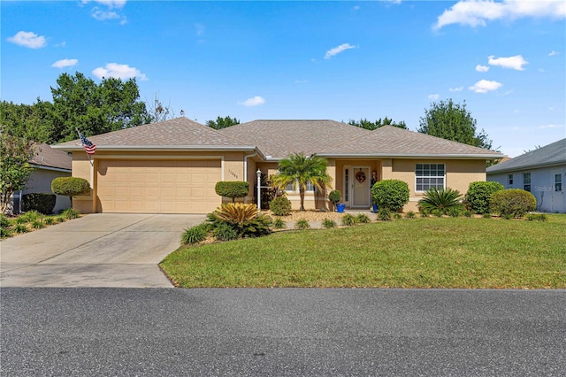 ranch-style house featuring a front lawn and a garage