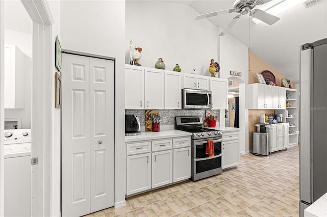 kitchen featuring appliances with stainless steel finishes, ceiling fan, high vaulted ceiling, washer / clothes dryer, and white cabinetry