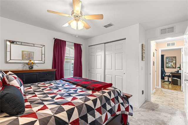 bedroom featuring ceiling fan, carpet floors, and a closet