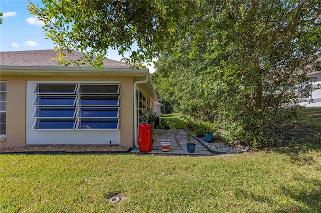 view of home's exterior with a lawn