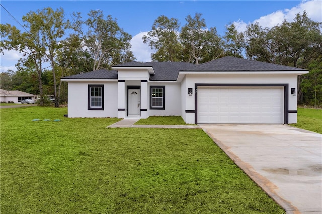 view of front of home featuring a front lawn and a garage