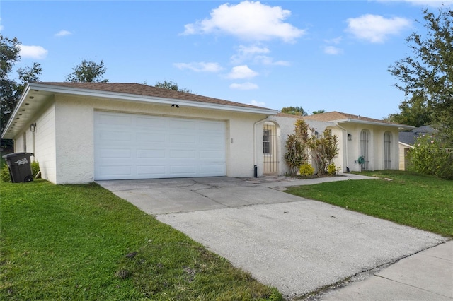 single story home featuring a garage and a front lawn