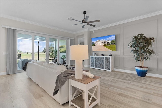 living room featuring ceiling fan, light hardwood / wood-style floors, and ornamental molding