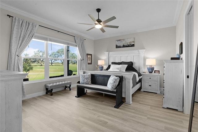 bedroom with ceiling fan, light hardwood / wood-style floors, and crown molding