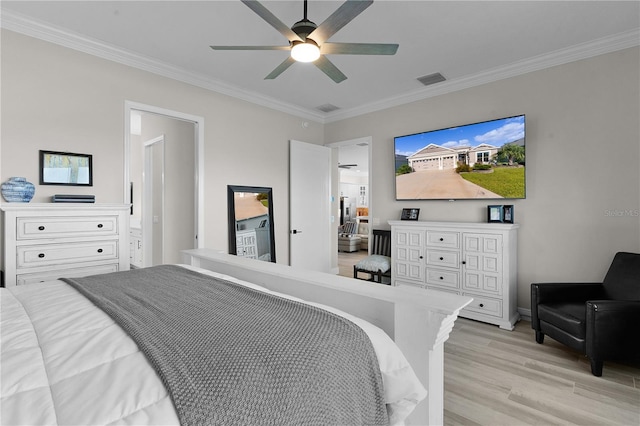 bedroom featuring light hardwood / wood-style flooring, ceiling fan, and crown molding