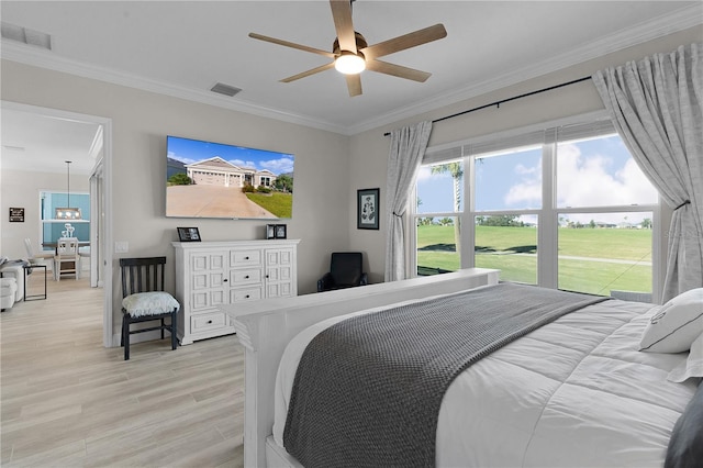 bedroom featuring light wood-type flooring, ceiling fan, and crown molding