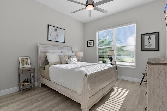 bedroom featuring ceiling fan and light hardwood / wood-style flooring