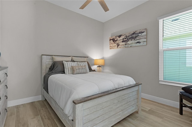 bedroom featuring ceiling fan and light hardwood / wood-style floors