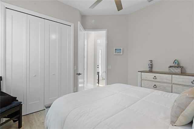 bedroom with light wood-type flooring, a closet, and ceiling fan