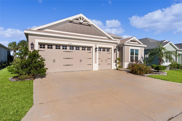 craftsman-style home featuring a garage and a front yard