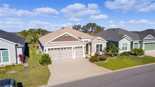 view of front facade with a garage and a front lawn