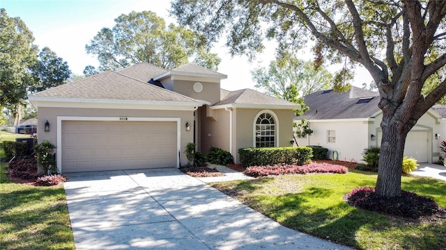 view of front of property with a front lawn and a garage