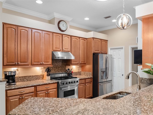 kitchen with visible vents, under cabinet range hood, a sink, stainless steel appliances, and light stone countertops