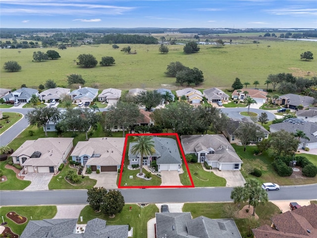 birds eye view of property with a residential view