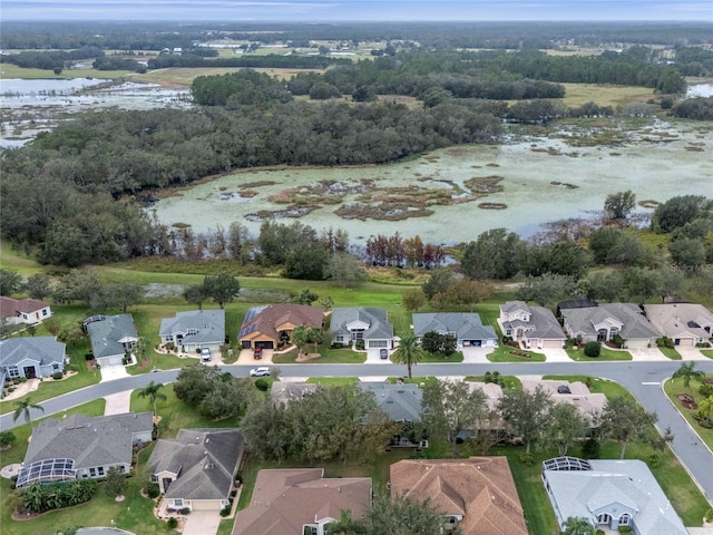 birds eye view of property with a residential view and a water view