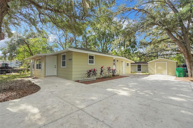 single story home with a shed