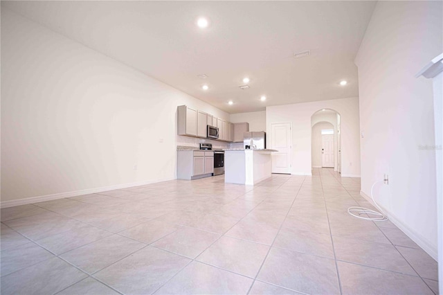 unfurnished living room featuring light tile patterned floors