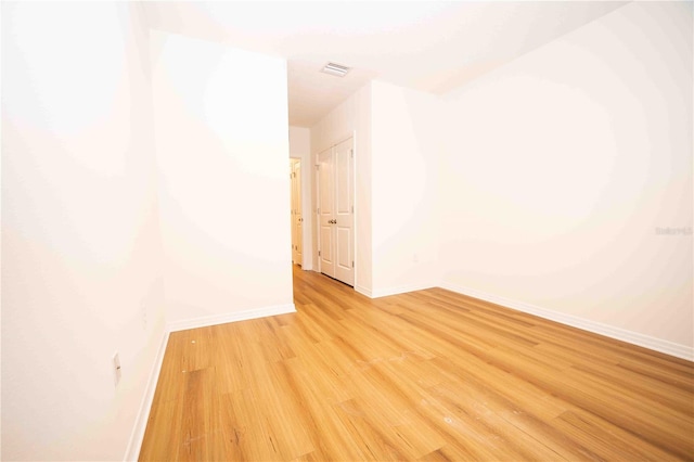 spare room with light wood-type flooring