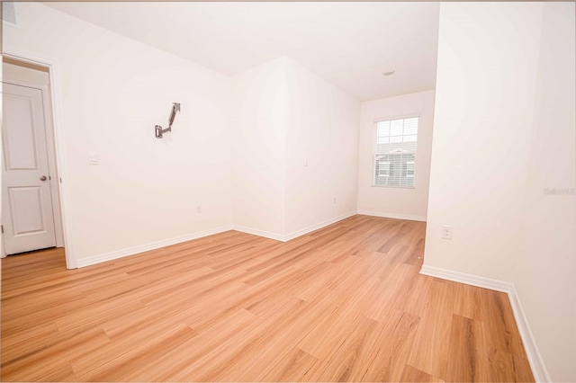 spare room with light hardwood / wood-style floors