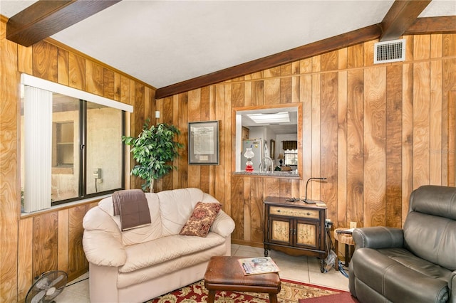 tiled living room with vaulted ceiling with beams and wood walls