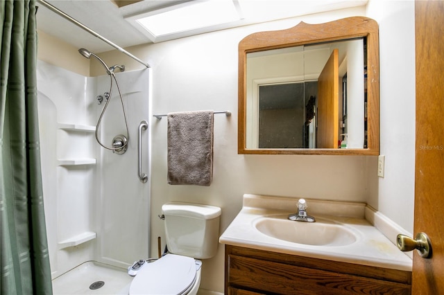 bathroom with vanity, toilet, and walk in shower