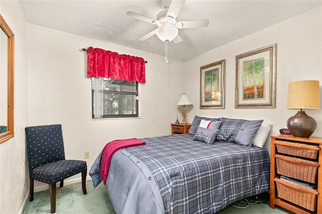 bedroom featuring ceiling fan and carpet