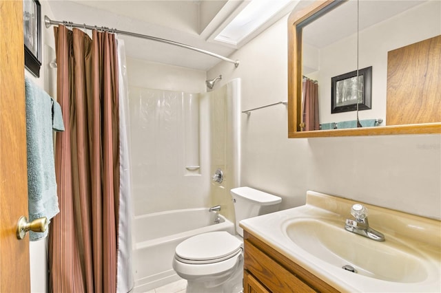 full bathroom with vanity, shower / tub combo, and toilet