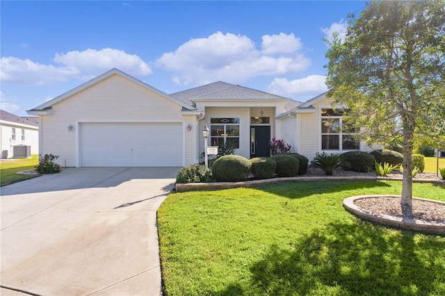 single story home featuring a front yard, a garage, and central AC unit