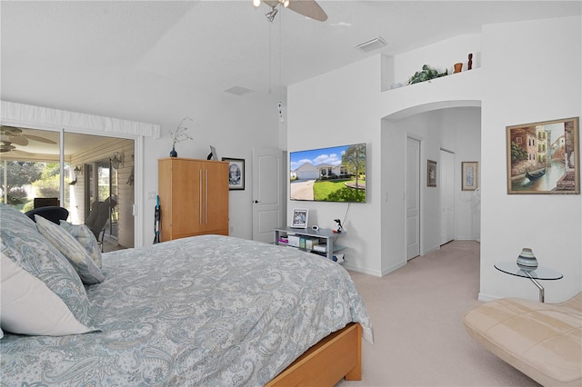 bedroom featuring ceiling fan, light carpet, and access to outside