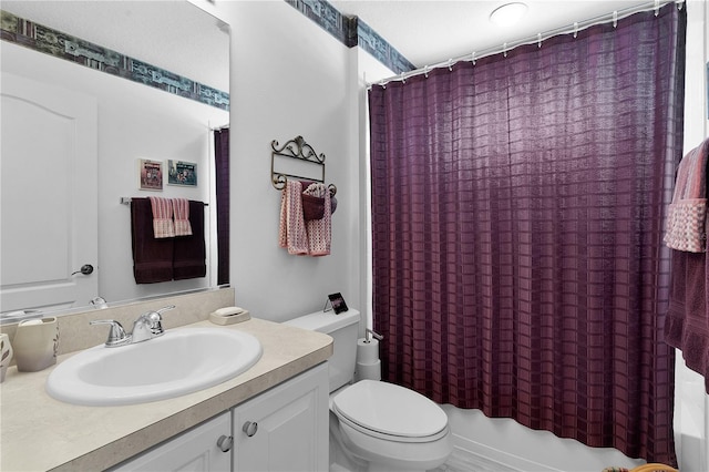 full bathroom with vanity, toilet, and shower / bath combo with shower curtain