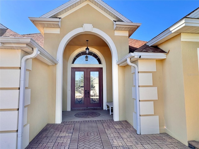 view of exterior entry featuring french doors