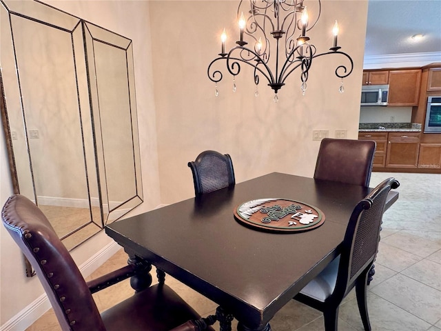 tiled dining space with a notable chandelier and crown molding