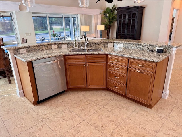 kitchen with light stone counters, dishwasher, ornamental molding, and sink