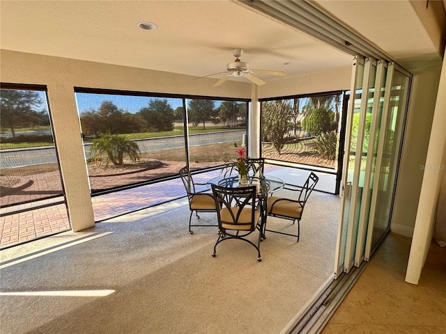 sunroom / solarium with ceiling fan