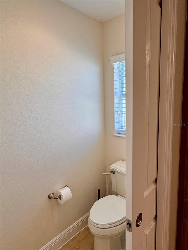 bathroom featuring tile patterned floors and toilet