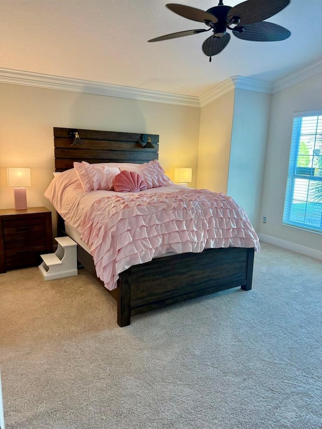 bedroom with ceiling fan, carpet, and ornamental molding