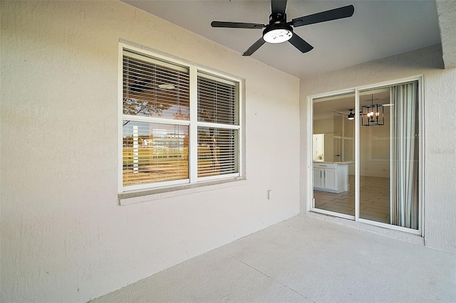 view of patio featuring ceiling fan