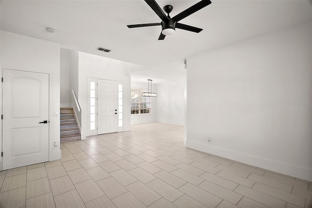 unfurnished living room with ceiling fan