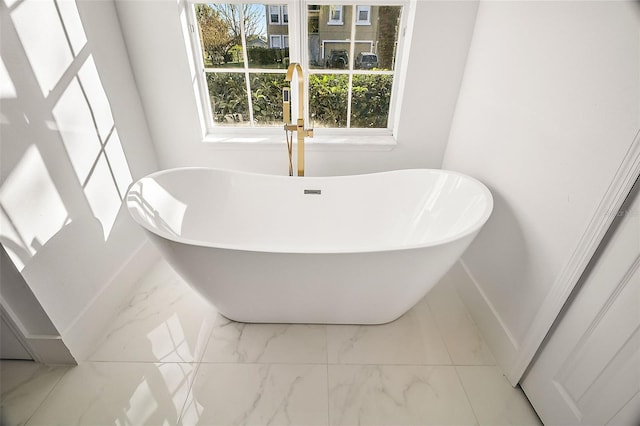 bathroom with a bathing tub and sink