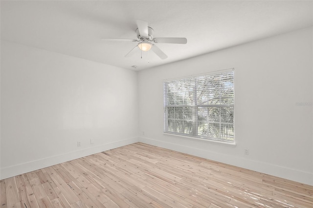 spare room featuring ceiling fan and light hardwood / wood-style flooring