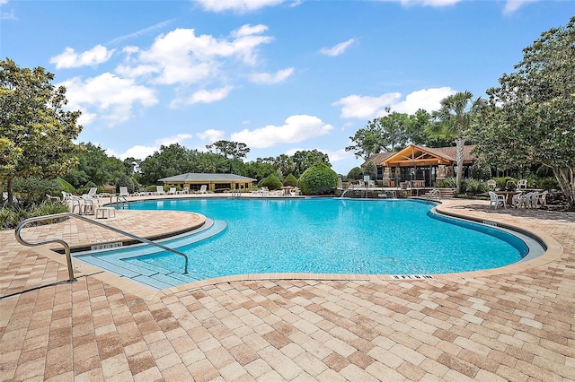 view of swimming pool featuring a patio area