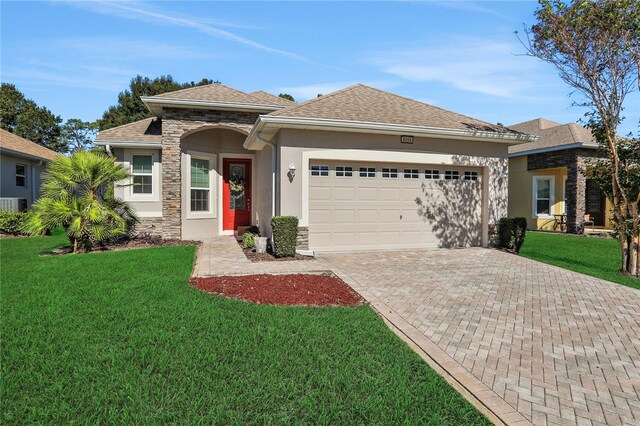 view of front of home featuring a garage and a front yard