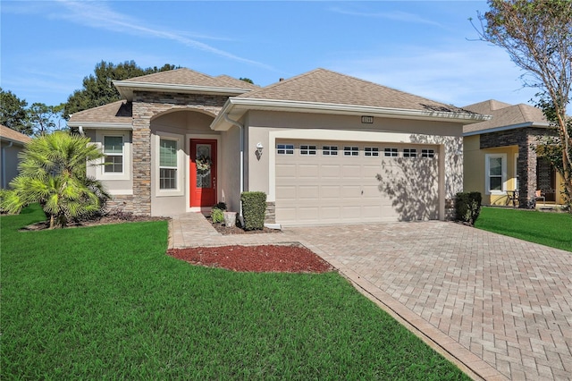 view of front of property with a front lawn and a garage