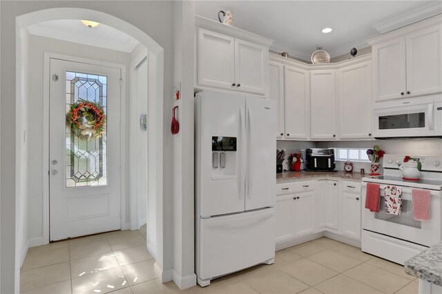 kitchen with white cabinets, white appliances, and ornamental molding