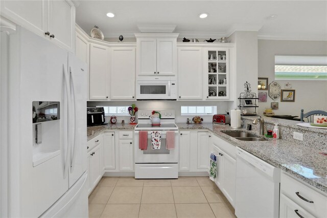 kitchen with crown molding, sink, white cabinets, and white appliances