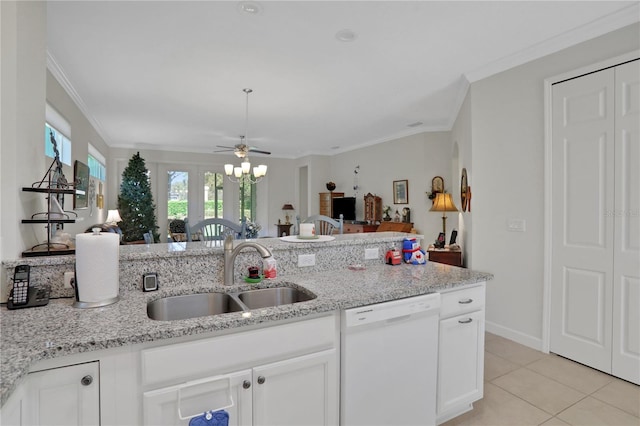 kitchen with crown molding, sink, white dishwasher, and ceiling fan